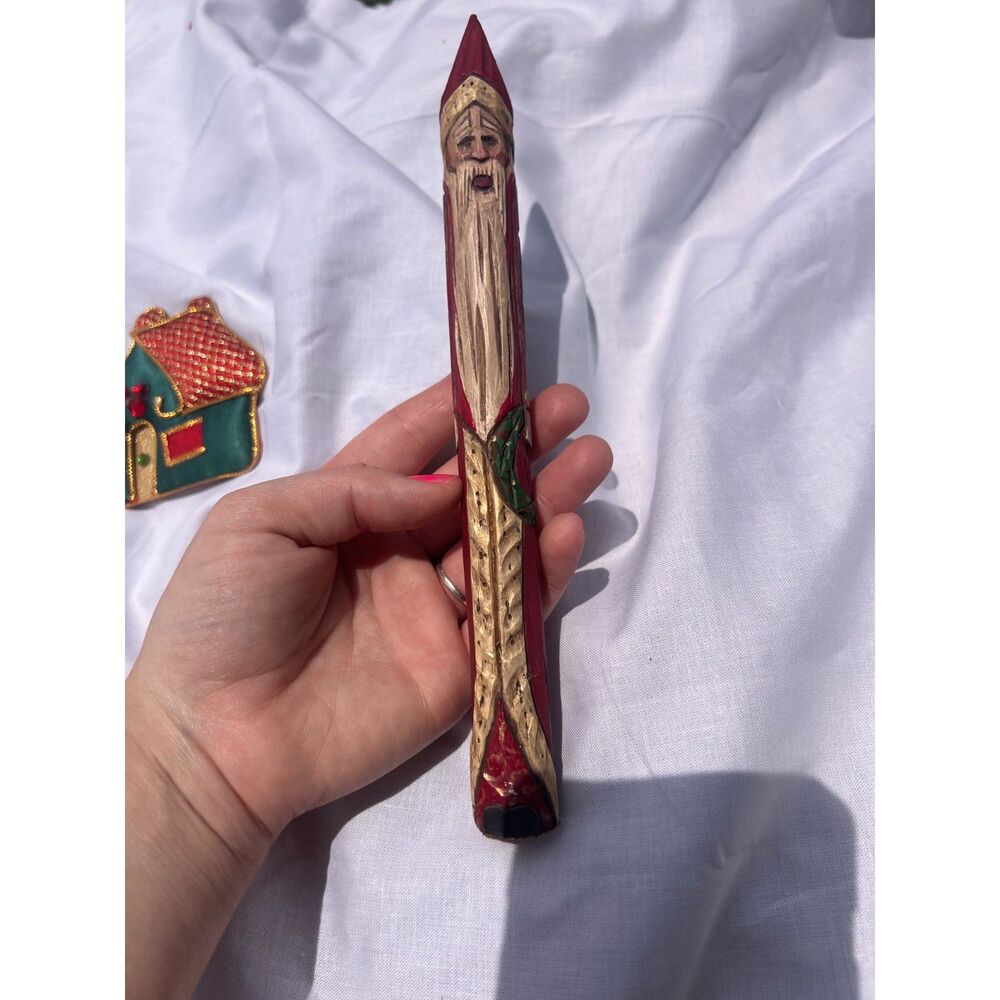 hand carved wooden folk art"pencil Santa" figurine and vintage christmas magnet